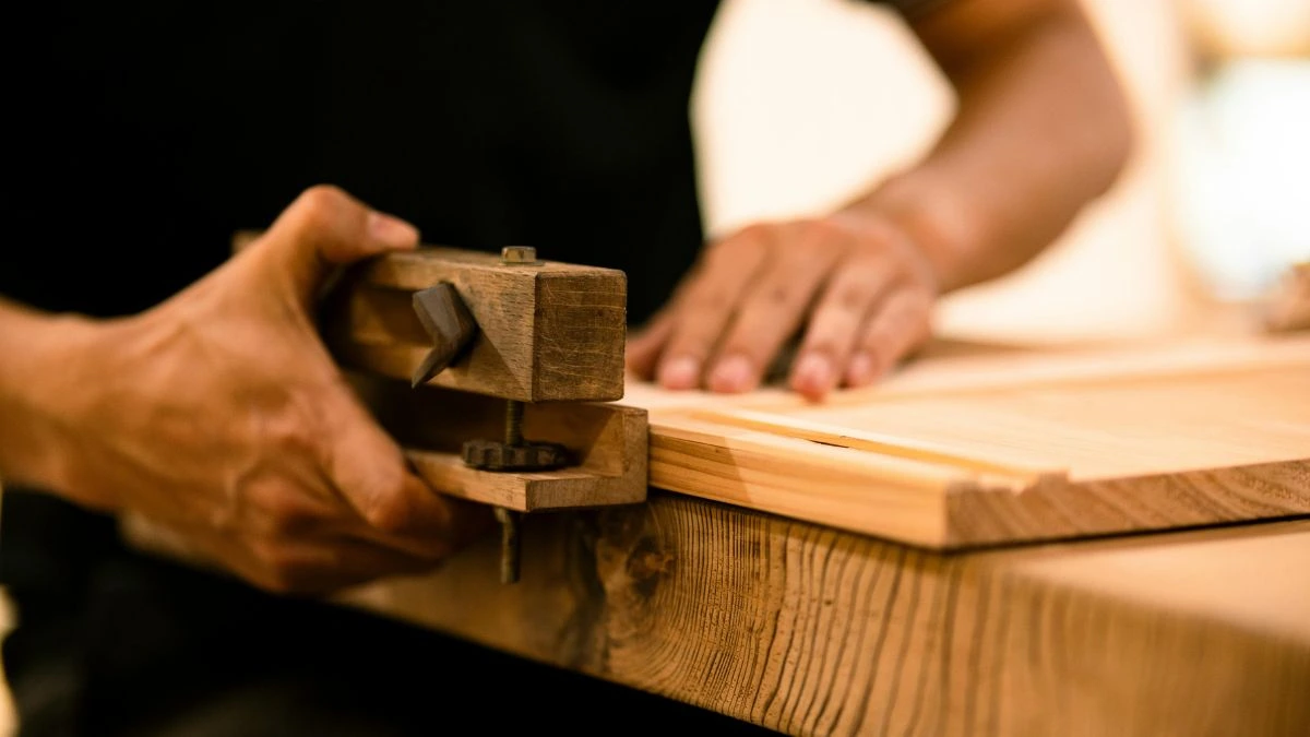 a picture of carpenter working on wood